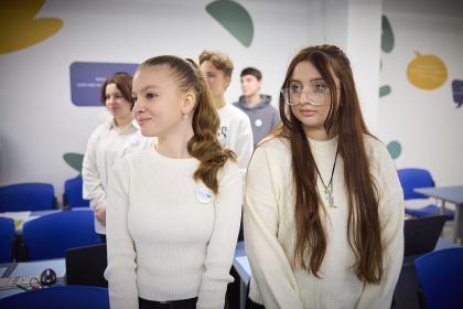 Students learning in a phone-free classroom, focused on their lesson